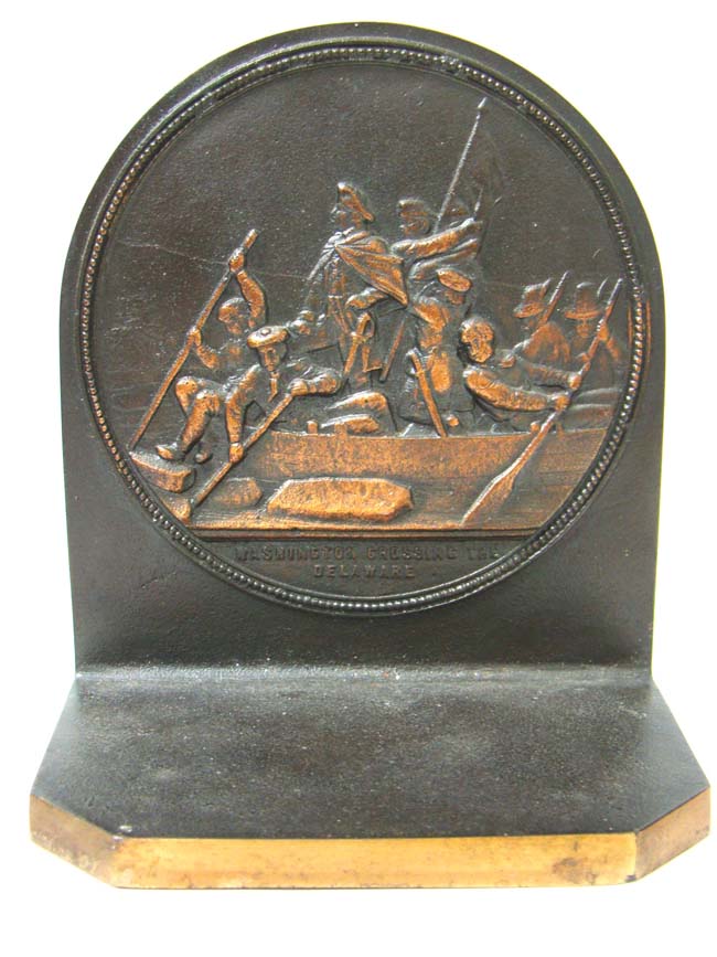 A pair of Antique Bookends circa 1930 depicting Washington Crossing the Delaware and Columbus Discovering America